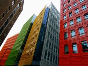 Vibrant colored skyscrapers in a modern cityscape showcasing innovative architecture and design.